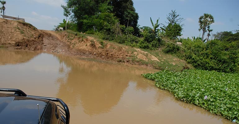 a vehicle travelling in a river