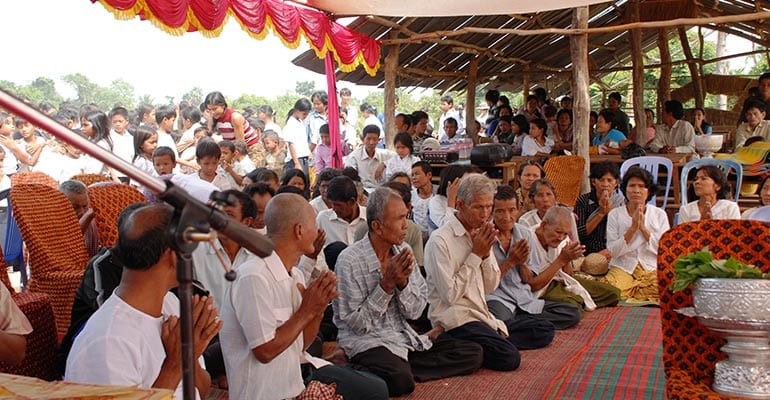 elderly people kneeling on a floor