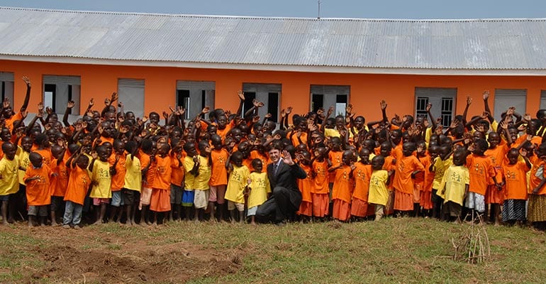 children waving their hands