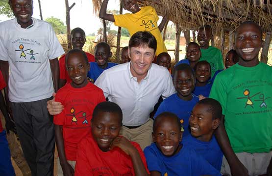 Lawrence Sizemore with a group of smiling African kids