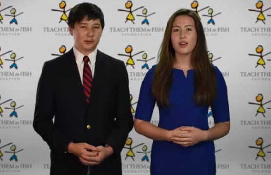 a male and a female in front of a Teach Them To Fish Foundation backdrop